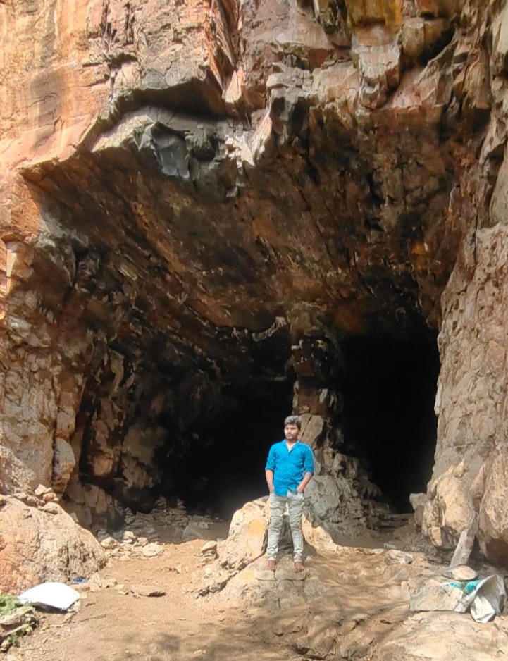 The massive cliff and cave entrance of Ulleda
